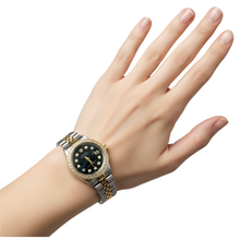 Afbeelding in Gallery-weergave laden, Datumjust dames Rolex-horloge met zwarte diamanten wijzerplaat en gouden armband