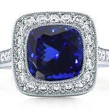 Afbeelding in Gallery-weergave laden, 14,75 ct. bezel set tanzanite met diamanten ring goud 14k