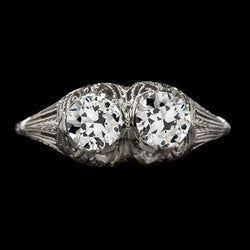 Edwardiaanse Damesring met 2 uit de a aarde gewonnen diamanten in oud slijpsel