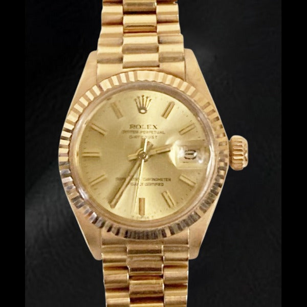 Rolex Datejust presidentiële stijl 26 mm champagne wijzerplaat geelgoud dameshorloge