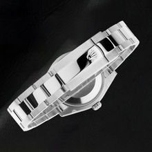 Afbeelding in Gallery-weergave laden, Rolex Datumjust 31 mm mintgroen roestvrijstalen horloge met lichtgevende wijzerplaat
