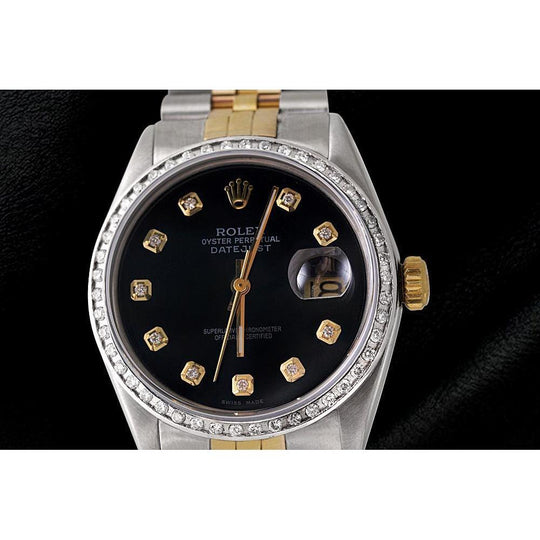 diamanten lunette heren Rolex horloge zwarte diamanten wijzerplaat Datumjust armband
