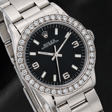 Afbeelding in Gallery-weergave laden, Rolex Oyster Perpetual 26mm 76030 Horloge met Zwarte Arabische Wijzerplaat en Diamanten Lunette
