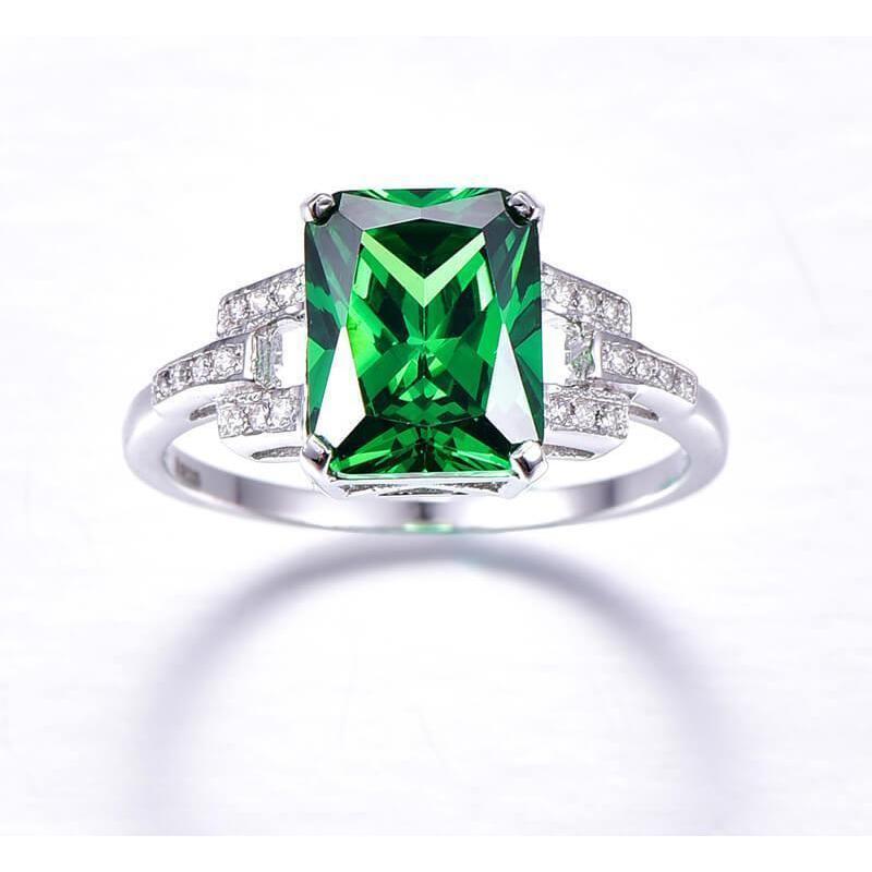 10.70 karaats ring met groene smaragd en diamanten WG 14K - harrychadent.nl