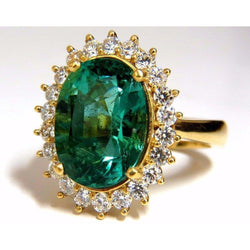 11 kt ovale groene smaragd met diamanten trouwring 14K geel goud