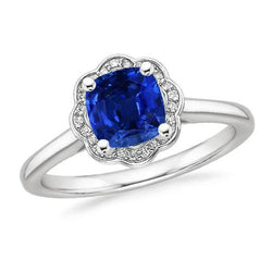 1,5 ct blauwe kussen saffier en ronde diamanten ring