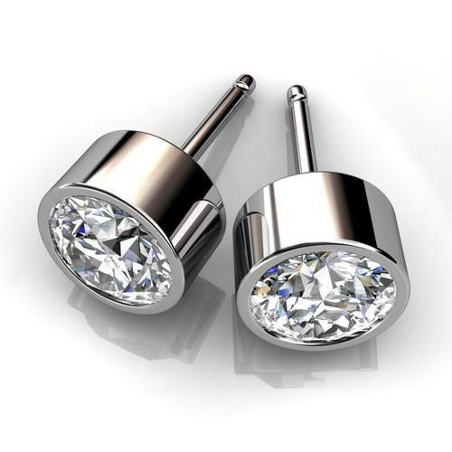 1.4 ct Solitaire ronde bezel set diamanten oorknopjes 14K witgoud - harrychadent.nl