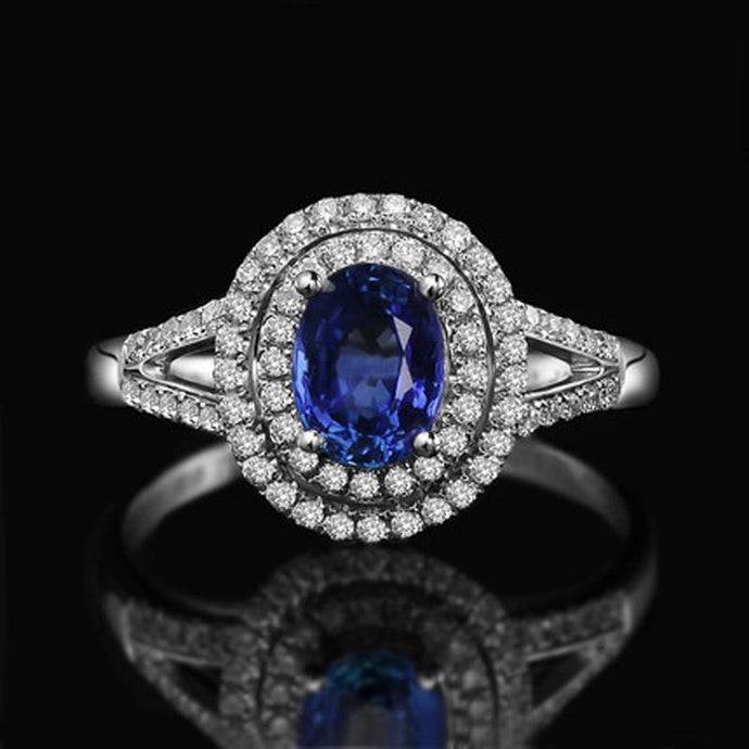 2,45 ct blauwe ovale saffier met diamanten trouwring 14k witgoud