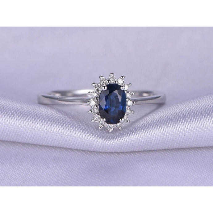 2,5 karaat blauwe ovaal geslepen saffier en diamanten ring wit goud 14k