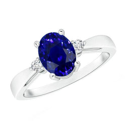 3 stenen ring ovale blauwe saffier en diamant 4,75 karaat taps toelopende schacht