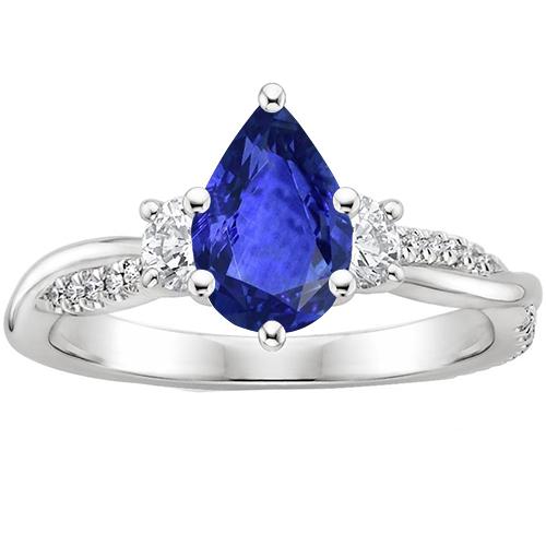 3 stenen stijl ring met accenten diamant en peer blauwe saffier 6 karaat - harrychadent.nl
