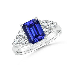 4 ct Emerald Cut Ceylon blauwe saffier en ronde diamanten trouwring