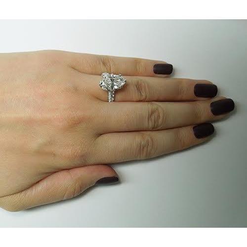 5 karaat ovale en ronde diamanten ring met accentjuwelen - harrychadent.nl