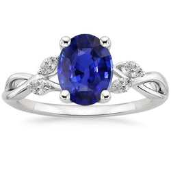 Blauwe saffier trouwring met markiezin diamanten 4 karaat twist stijl