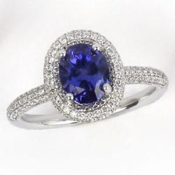 Blauwe tanzaniet met diamanten 10,75 ct trouwring wit goud 14k