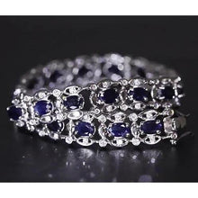 Afbeelding in Gallery-weergave laden, Ceylon blauwe diamanten armband 21 karaat witgoud 14K - harrychadent.nl

