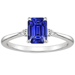 Diamanten ring met 3 stenen smaragd en peer blauwe saffier 3,25 karaat