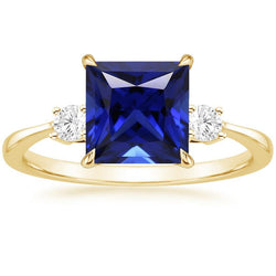 Geelgouden ring met 3 stenen prinses blauwe saffier en diamanten 5,25 karaat