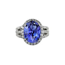 Afbeelding in Gallery-weergave laden, Grote ovale tanzaniet met kleine ronde diamanten 6.70 ct ring goud 14k - harrychadent.nl
