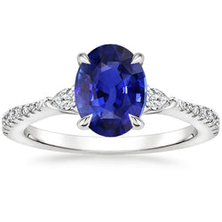 Solitaire blauwe saffier met peer en ronde diamanten accentring 3 karaat