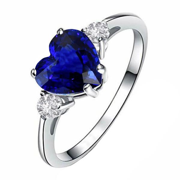 Verjaardag drie stenen hart blauwe saffier & diamanten ring 2,75 karaat - harrychadent.nl