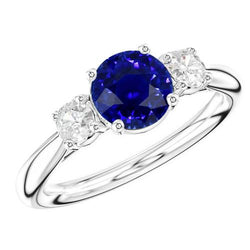 Verlovingsring met drie stenen ronde blauwe saffier 2,50 karaat diamanten